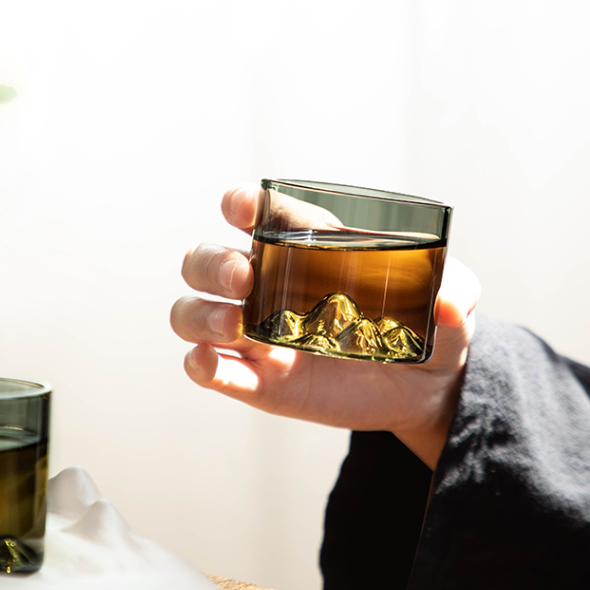 Distant mountain glass tea cup