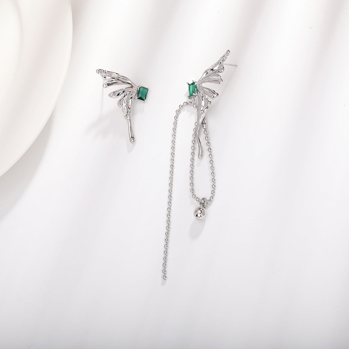 Asymmetric wing earrings