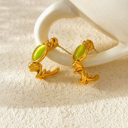 Original design S925 silver needle small fresh green cat's eye C word earrings irregular early spring new earrings 1238
