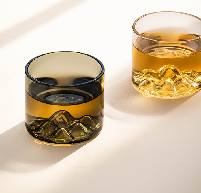 Distant mountain glass tea cup