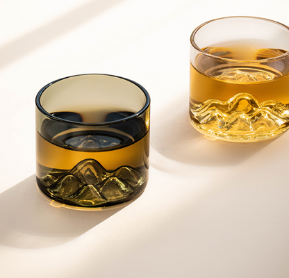 Distant mountain glass tea cup