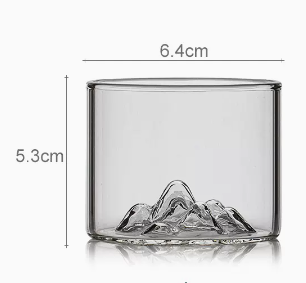 Distant mountain glass tea cup